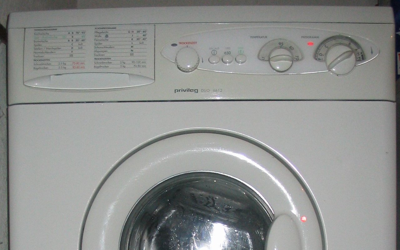 Control panel and drum door of a Privileg Duo washer-dryer, showing separate wash and dry program dials
