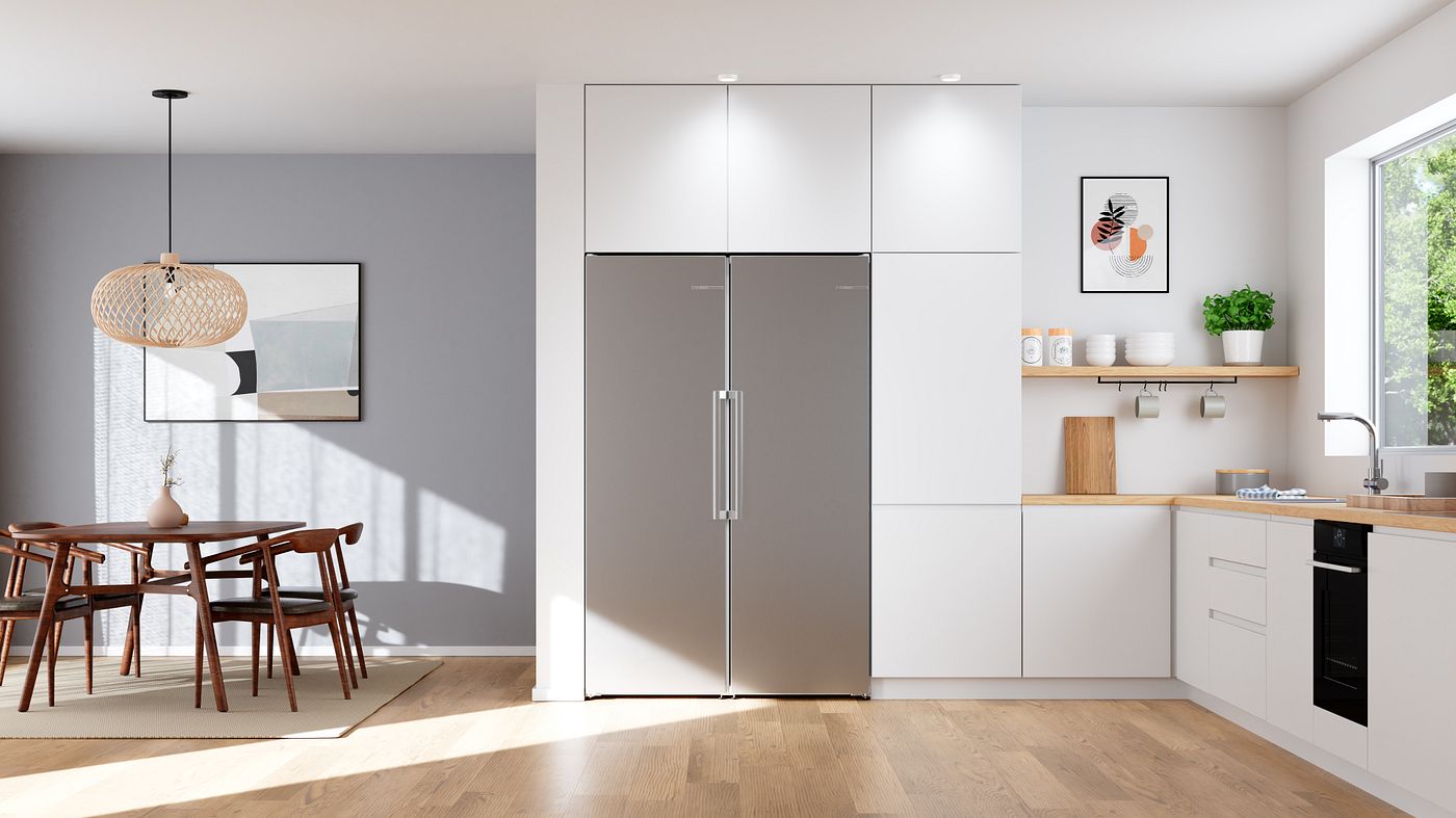 Two Bosch single-door fridge and freezer units built into white kitchen cabinetry side by side